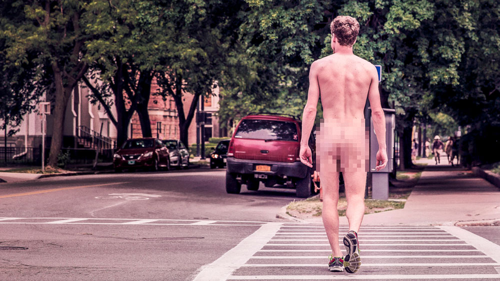 Naked man with tennis shoes crossing the street at a crosswalk, signifying that you should only commit to a price point once the scope is understood.