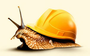 A snail wearing a hard hat as a shell, signifying the slow but steady improvements in the construction industry per the Architectural Billings Index.
