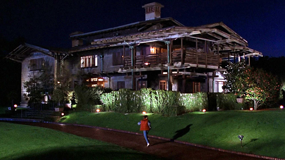 Marty McFly running up the driveway of the 3-story arts and crafts style Gamble House, used as the set for the home of Doc Brown in Back to the Future