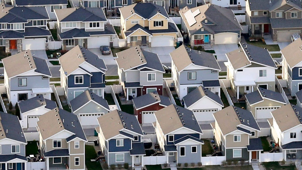 An entire neighborhood of tract homes that all look alike, signifying the lack of architectural creativity in planned communities