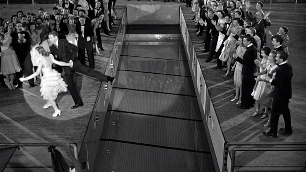 Jimmy Stewart and Donna Reed dancing on the edge of the retractable gym floor in "It's A Wonderful Life", about to fall into the pool