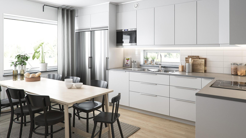 BoKlok home featuring modern white IKEA cabinetry and soapstone grey countertops in an airy kitchen with a large picture window