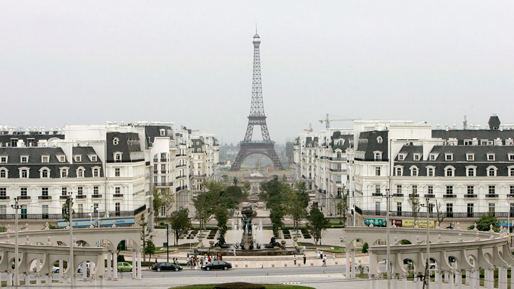 A 354-foot replica of the Eiffel Tower standing in the background of Shanghai's attempt to replicate the city of Paris, France