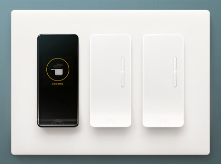 Noon Home modules setup in a 3 slot face plate, including one Room Director and two Extension dimmer switches