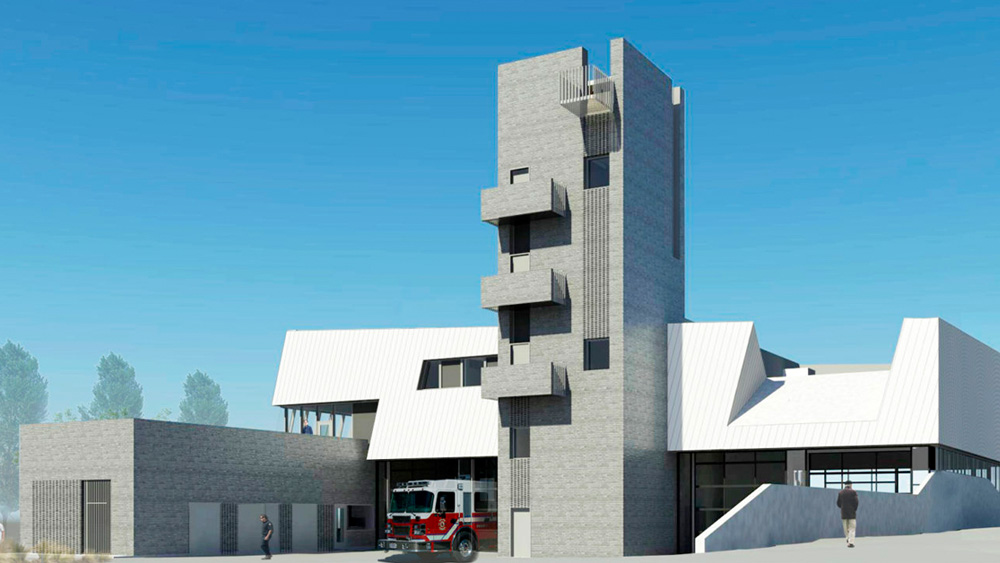 The redesigned zero carbon emission Fire Hall 17 in Vancouver with a four story concrete exterior tower, 4 engine bays, and white metal roof