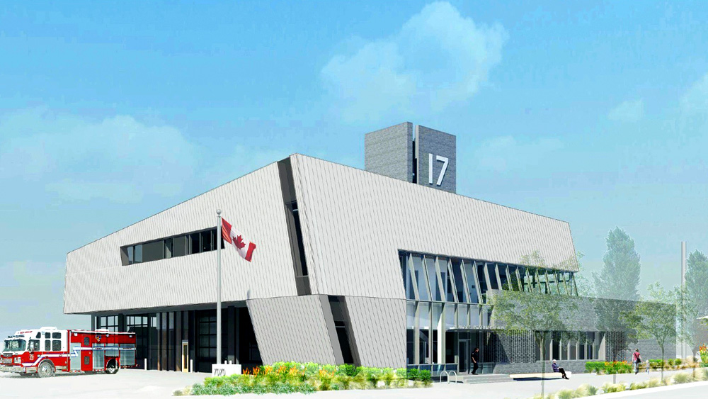 Street side view of the new 2-story Fire Hall 17 in Vancouver with large glass panels in concrete walls as part of the zero carbon emission design.