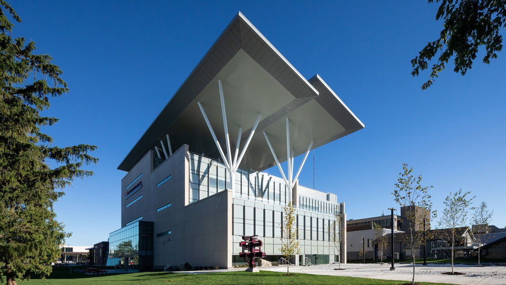 Exterior of the Joyce Center, Ontario, CA, with solar PV arrays and energy efficient glass curtain walls.