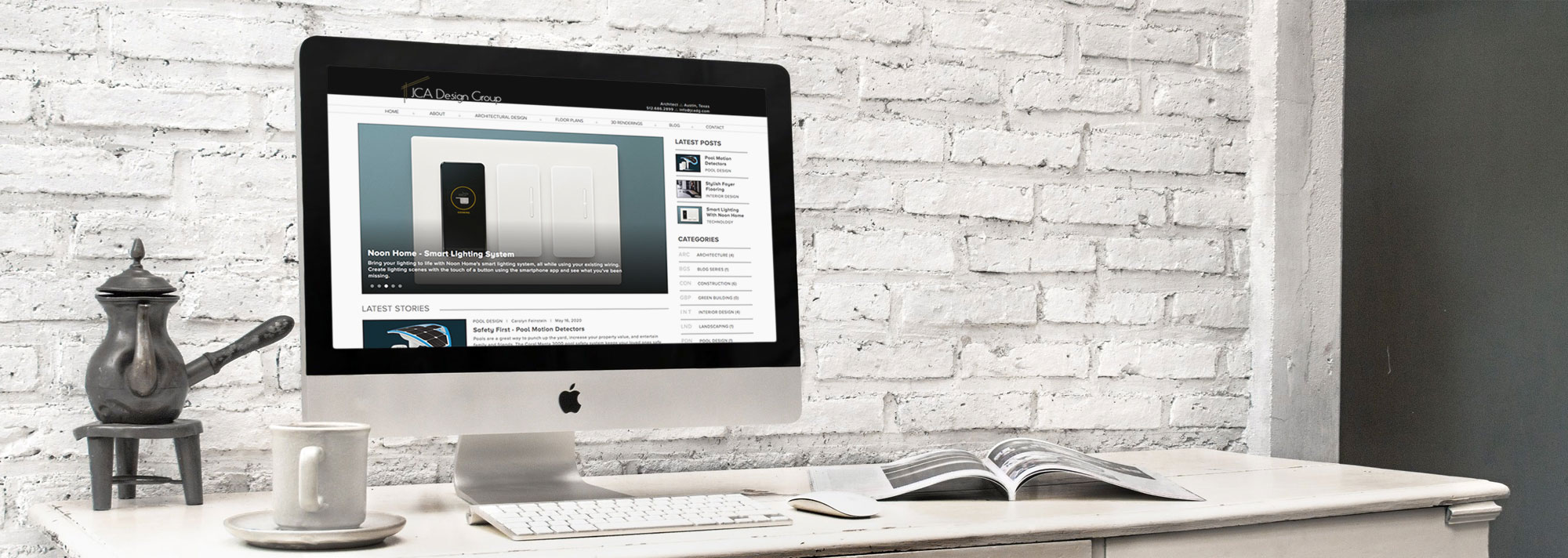 Desk with coffee cup and Apple iMac