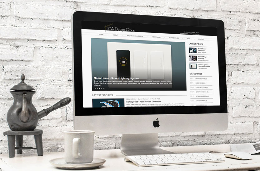 Desk with coffee cup and Apple iMac